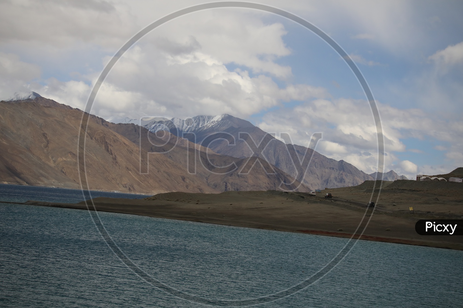 Beautiful River Valleys Of Leh / Ladakh with Sand Dunes , River and Cloudy Sky in Background Composition Shot