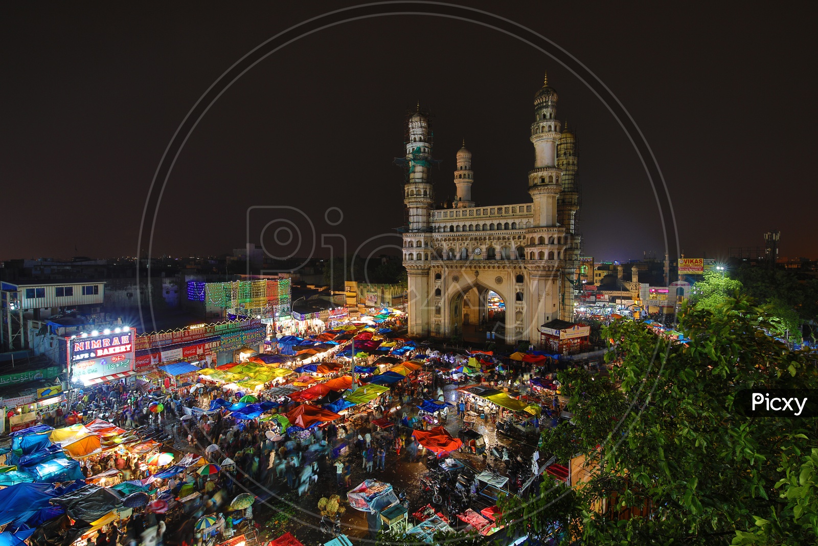 Charminar and Stalls around colorful/Indian Monument