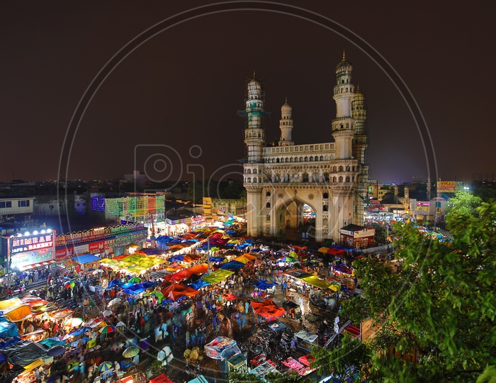 Charminar and Stalls around colorful/Indian Monument