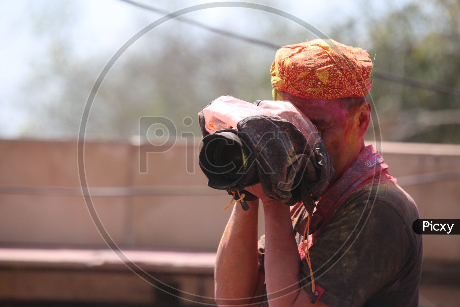 Photographer Capturing photos in Barsana Holi celebrations