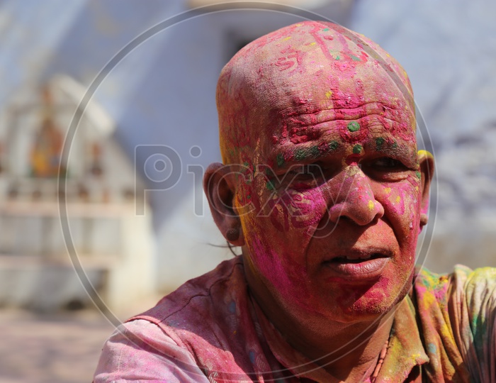 Man with Colors/Colours on face - Holi/Indian Festival - Festival of Colors