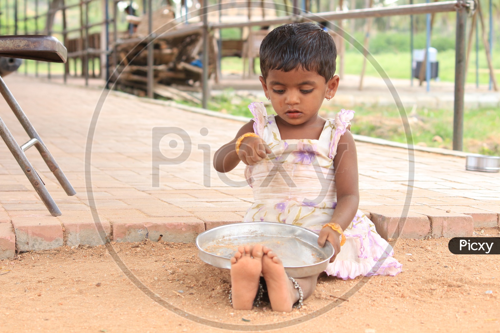 Little Girl playing with sand
