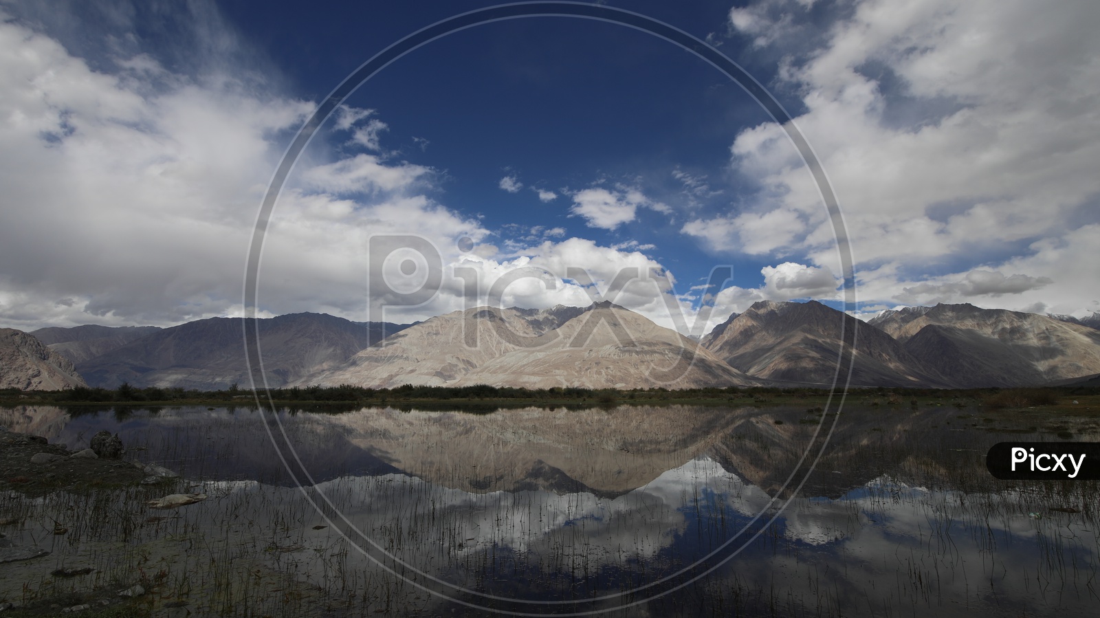 A Beautiful Reflection of Mountains on Water in River valleys of Leh