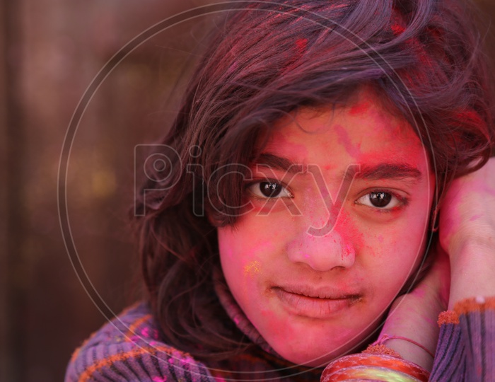 Girl with Colors/Colours on face - Holi/Indian Festival - Festival of Colors
