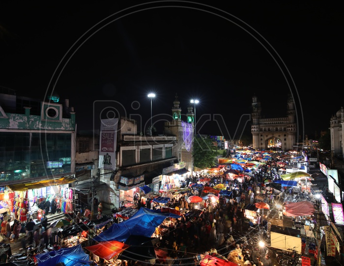 Mecca Masjid near Charminar and Stalls around colorful/Indian Monument