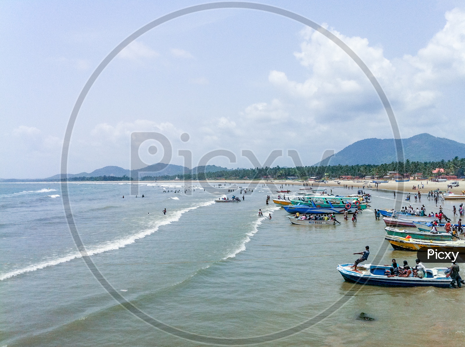 A Beautiful Beach With Fishing Boats and Visitors in Murudeshwar