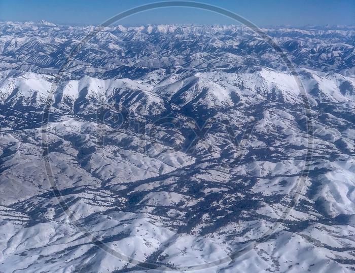 Ariel View of Snow Capped Mountains