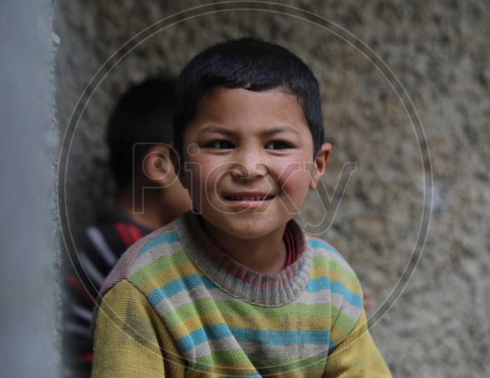 Portrait Of a Boy Child With Smiling Face In Leh