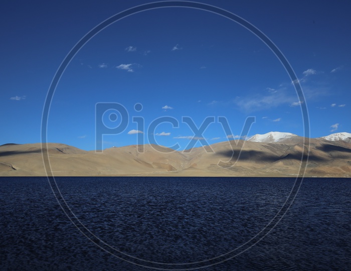 Beautiful Landscape of Snow Capped Mountains of Leh with lake in the foreground