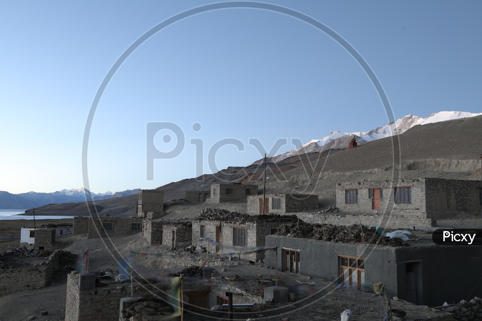 Houses of Leh with snow capped  mountains  in the background