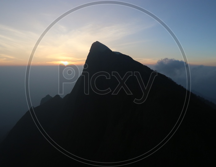 Landscape of beautiful Mountains of Munnar with sunrise in the background