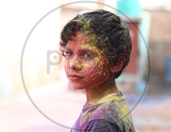 Boy with Colors on his face - Holi Celebrations - Indian Festival - Colors/Colorful at Nandagaon