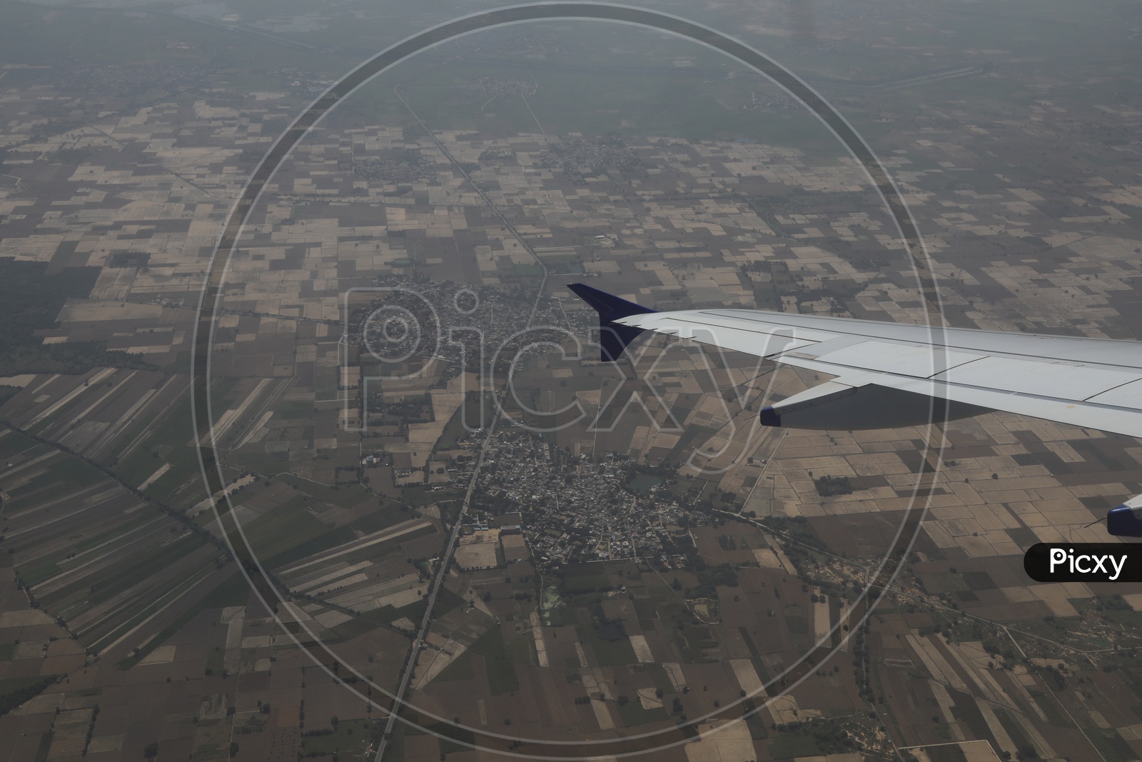 delhi in aerial view from flight window