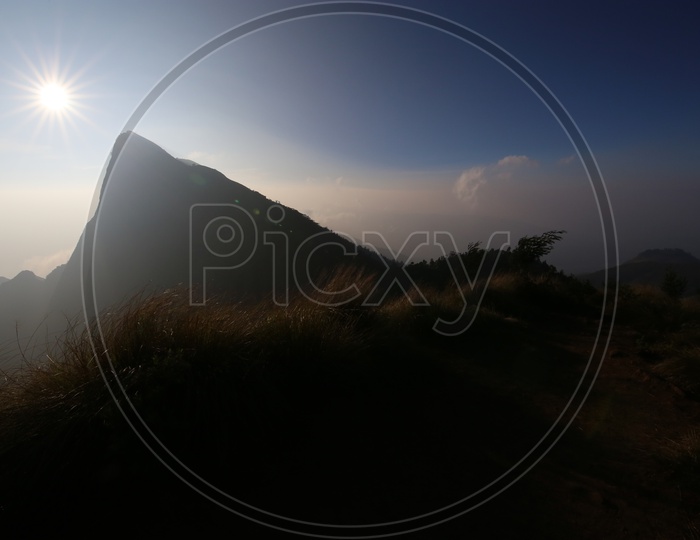 A Beautiful Sunset over The Hill Tops Of Munnar