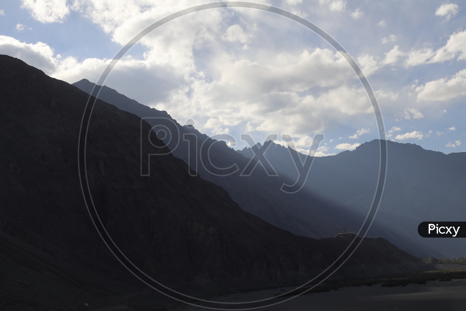 Beautiful Landscape of Snow Capped Mountains of Leh with clouds