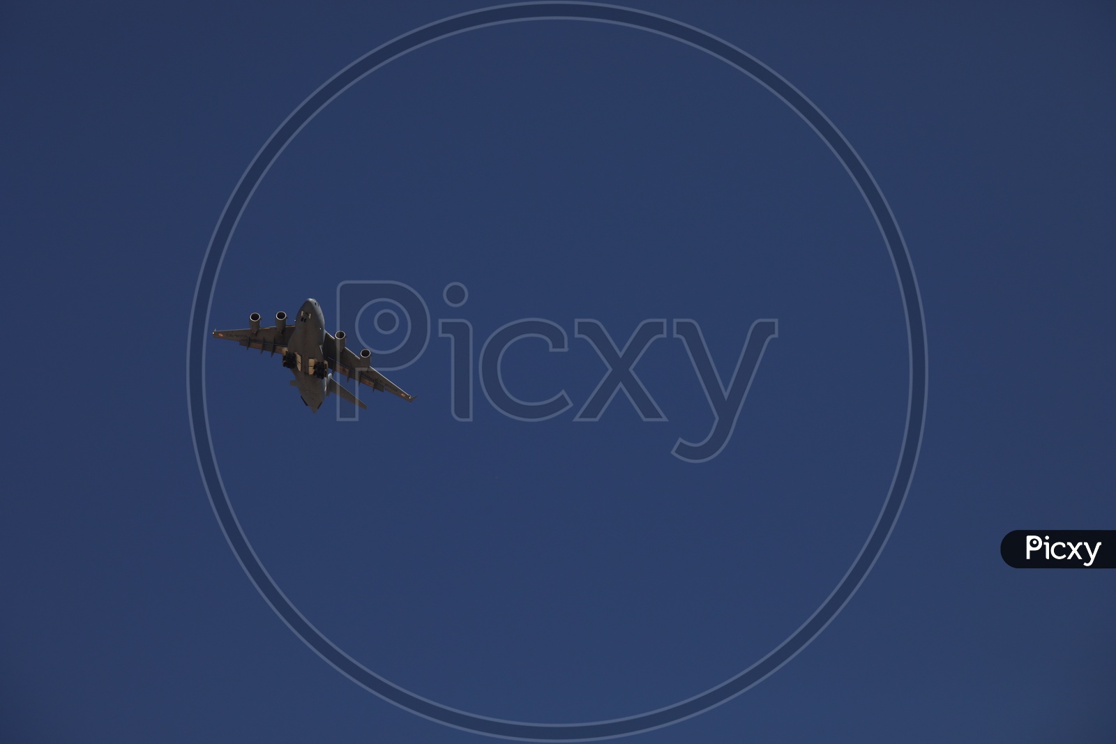 a flight flying in blue sky in Leh