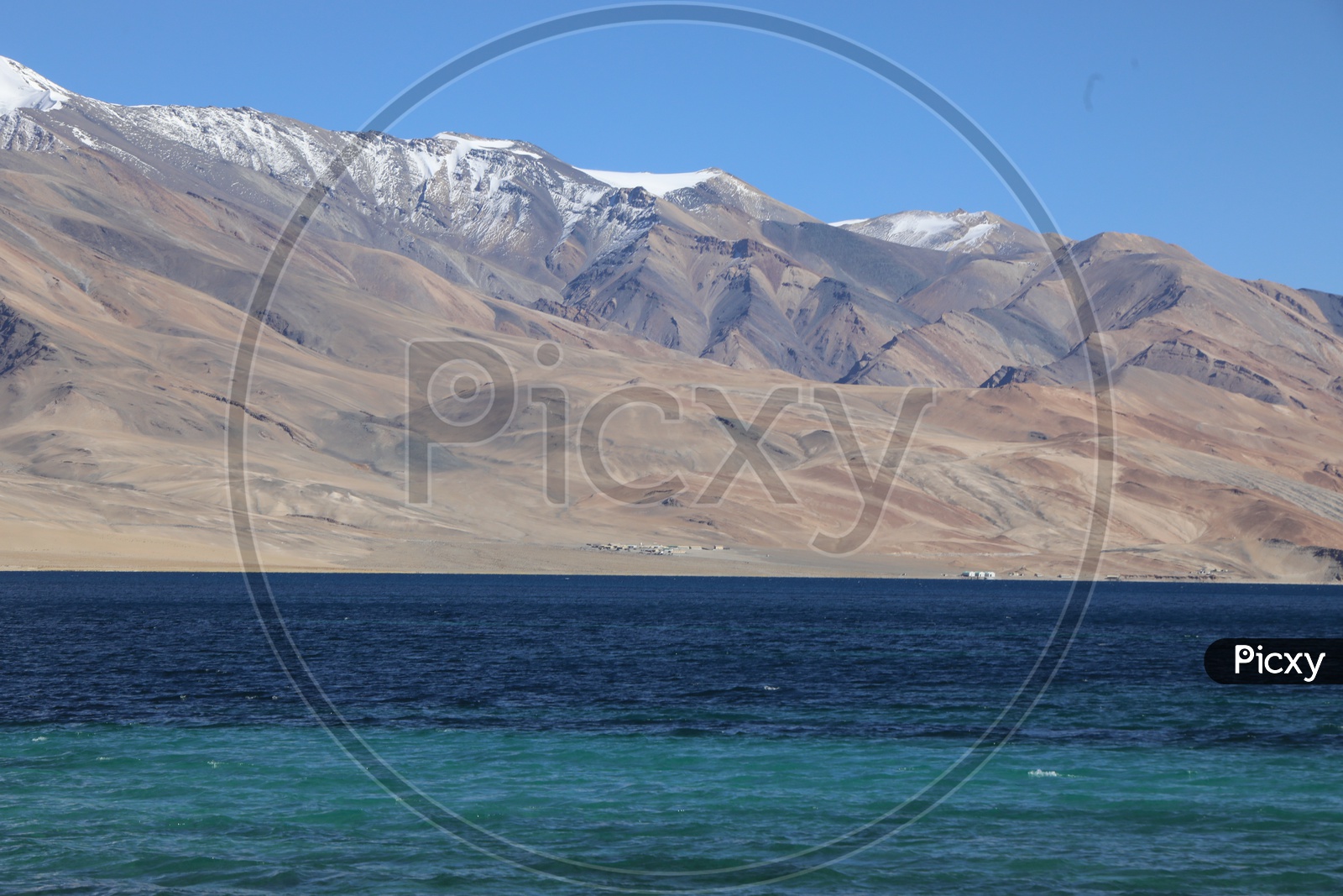 Beautiful Landscape of Snow Capped Mountains of Leh with tsomoriri lake in the foreground