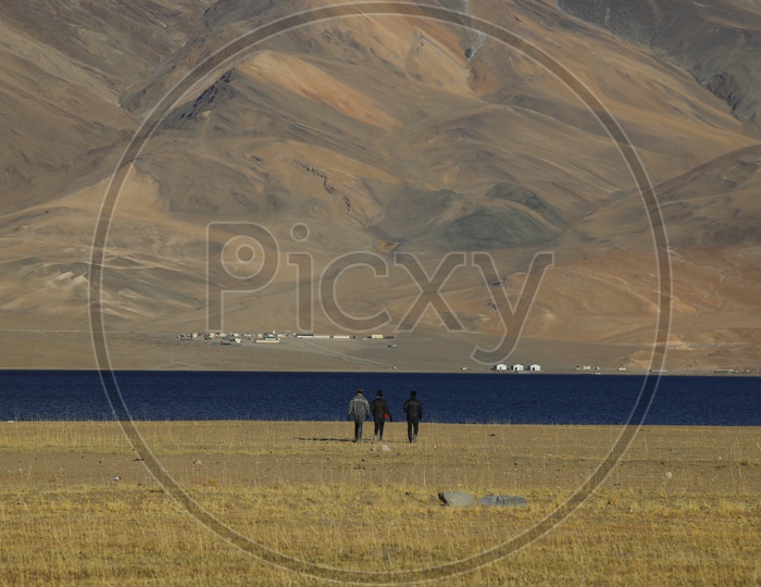 Tourists in The River Valleys Of Leh with Sand Dunes In Background
