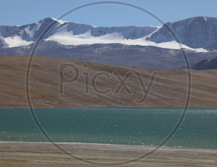 Beautiful Snow capped Mountains of leh with lake in the foreground