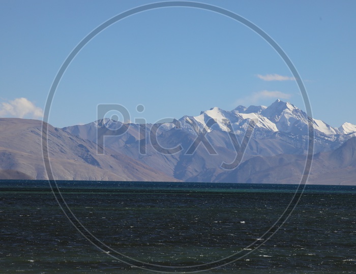 Beautiful Landscape of Snow Capped Mountains of Leh with Lake in the foreground