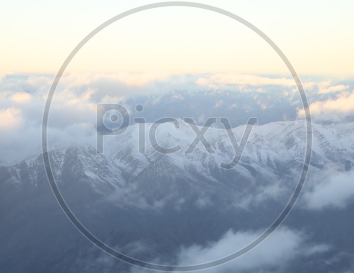 Beautiful Landscape of Snow Capped Mountains of Leh from flight window / Leh mountains in aerial view