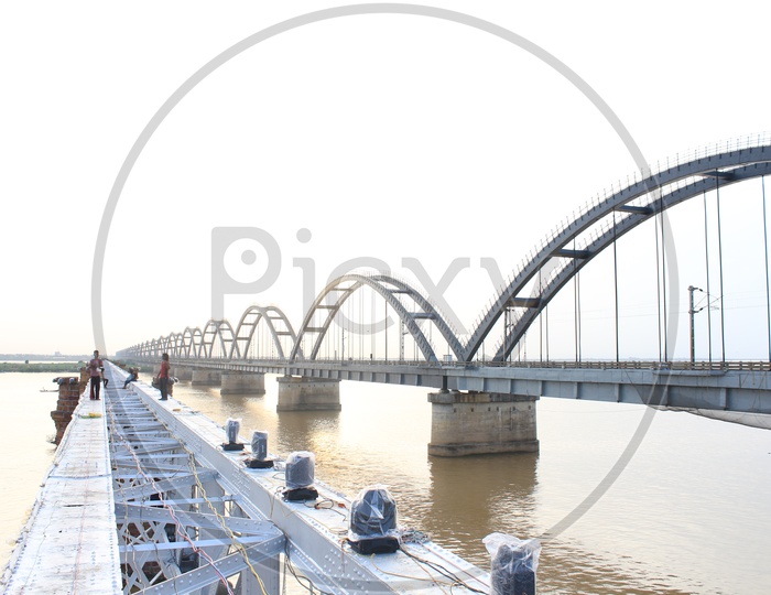 Image of An Electrical Worker Working On Rajahmundry Bridge Setting up ...