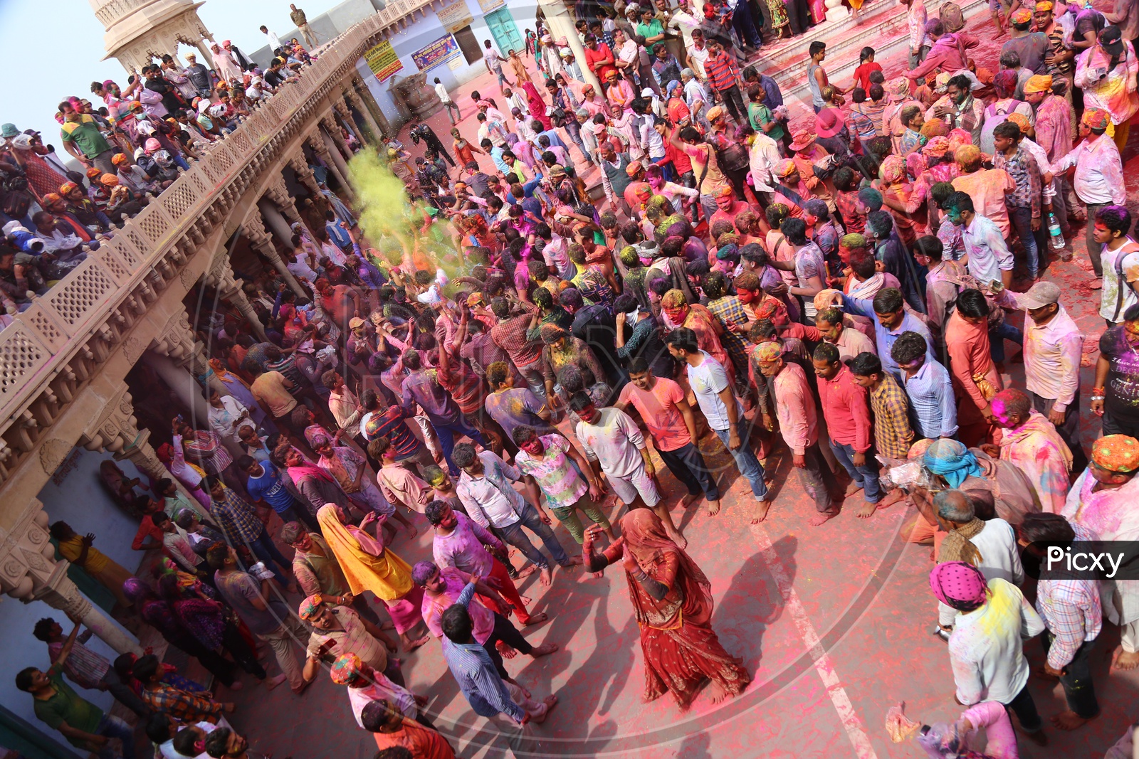 Woman Dancing at Holi Celebrations - Indian Festival - Colors/Colorful at Nandagaon Mandir