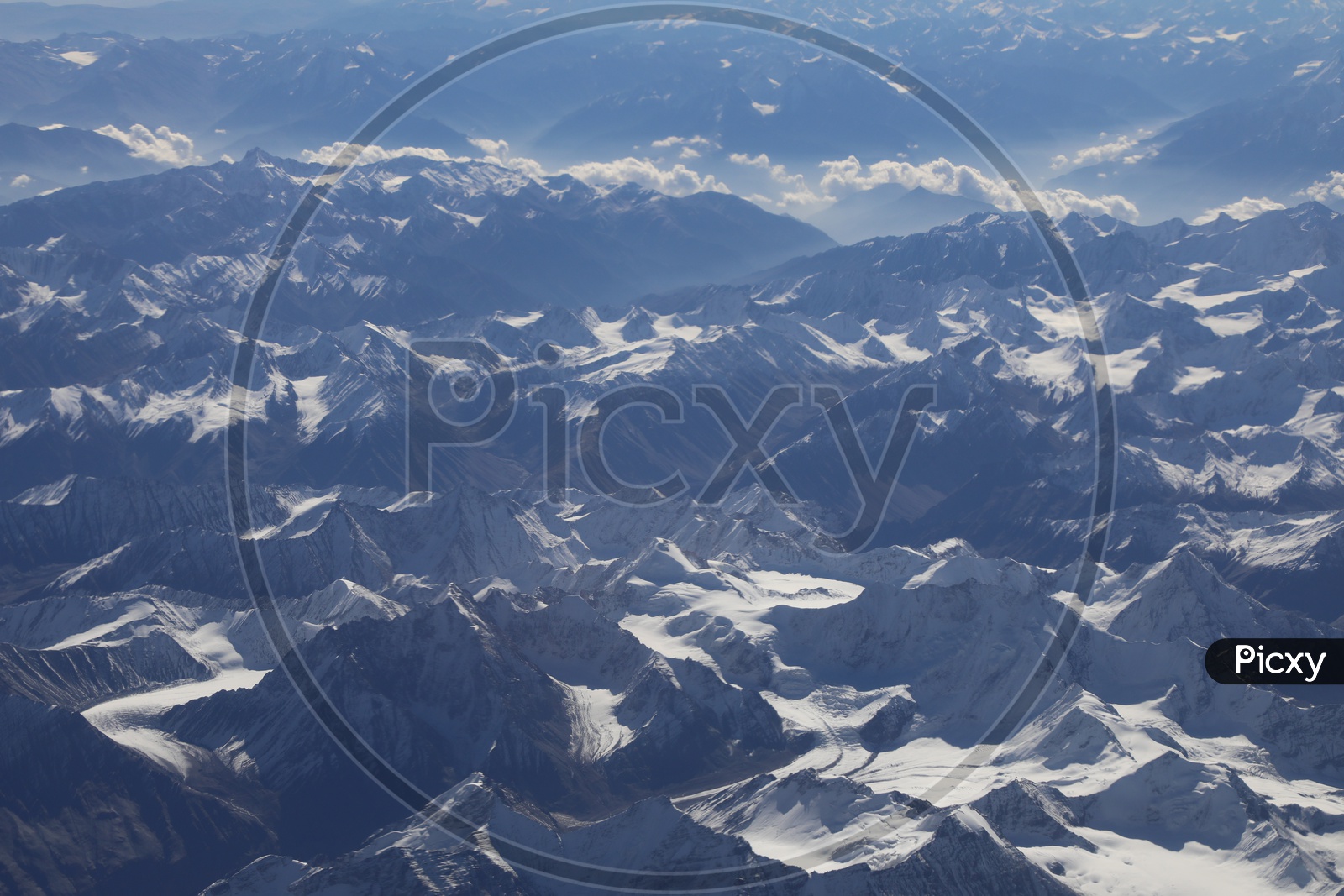 Beautiful Landscape of Snow Capped Mountains of Leh  from flight window / Leh mountains in Aerial View