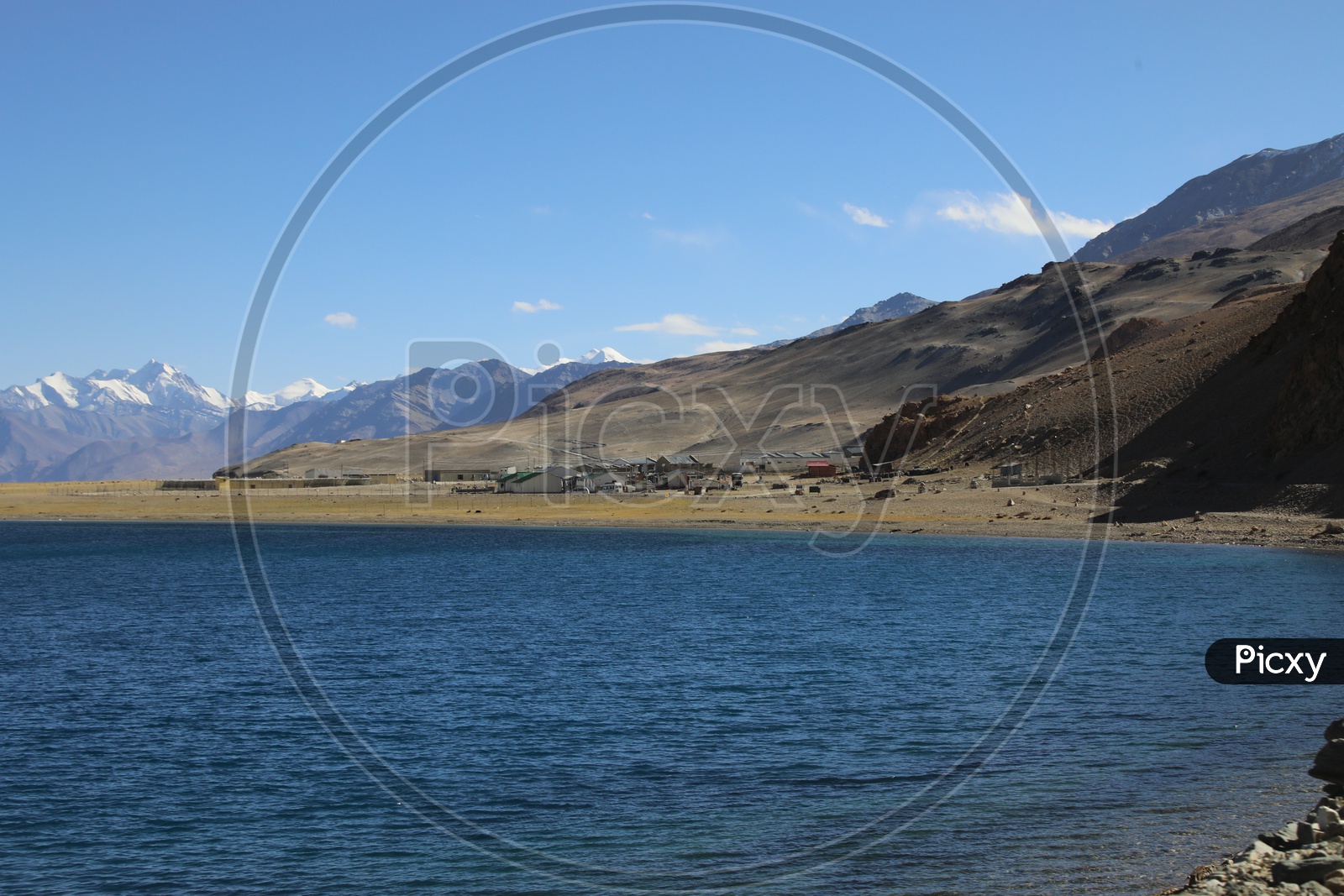 Beautiful Landscape of Snow Capped Mountains of Leh with tsomoriri lake in the foreground