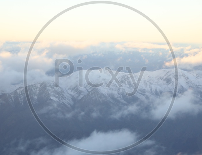 Beautiful Landscape of Snow Capped Mountains of Leh from flight window / Leh mountains in aerial view