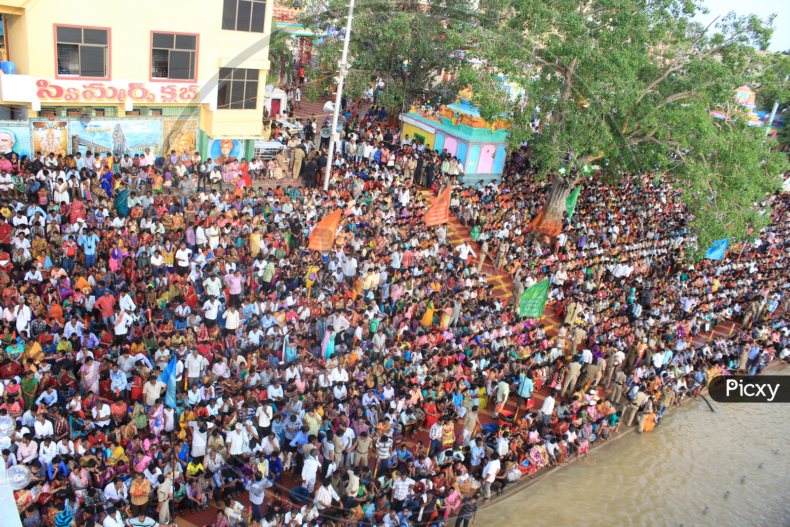 Aerial View Of Hindu Pilgrims Watching The Holy Harathi / aarti Of Godavari River in Rajahmundry