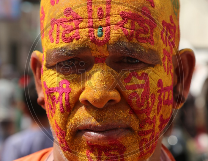 Old Man with Colors on his face - Holi Celebrations - Indian Festival - Colors/Colorful at Nandagaon
