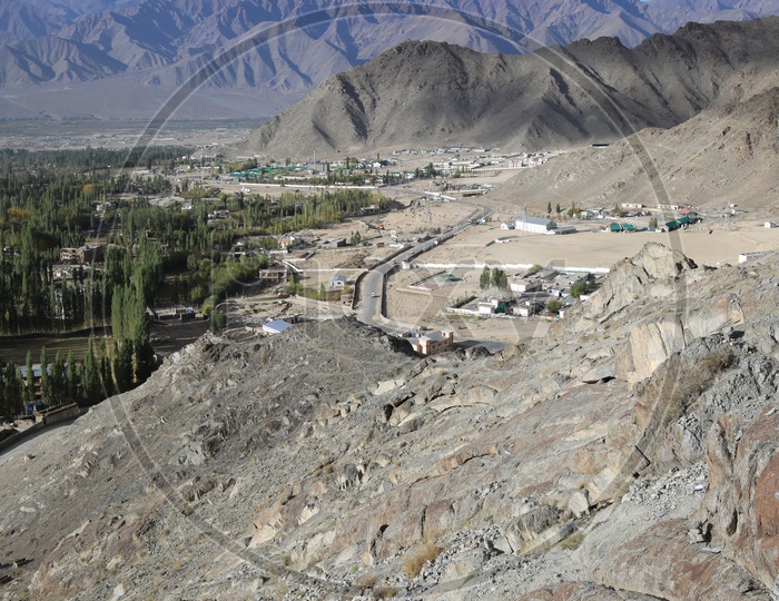 Beautiful  Snow Capped Mountains of Leh with leh village in the foreground
