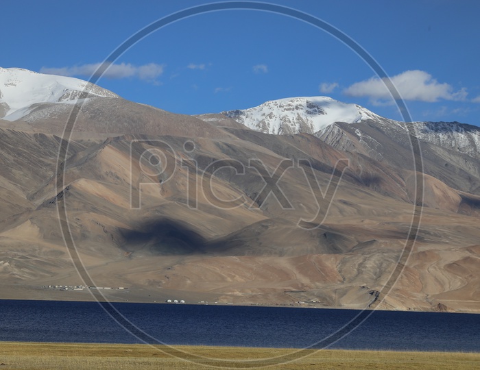 Beautiful Landscape of Snow Capped Mountains of Leh with lake in the foreground