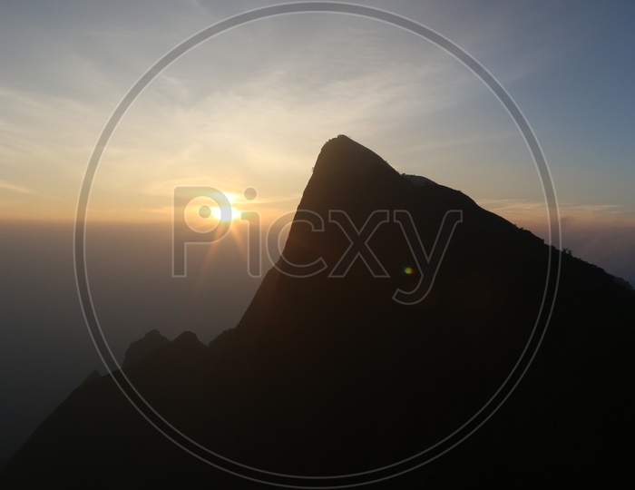 Landscape of beautiful Mountains of Munnar with sunrise in the background