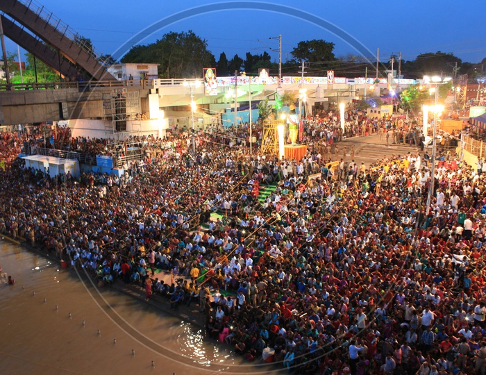 Hindu Pilgrims Watching The Holy Aarti / Harathi Of Godavari River in Rajahmundry