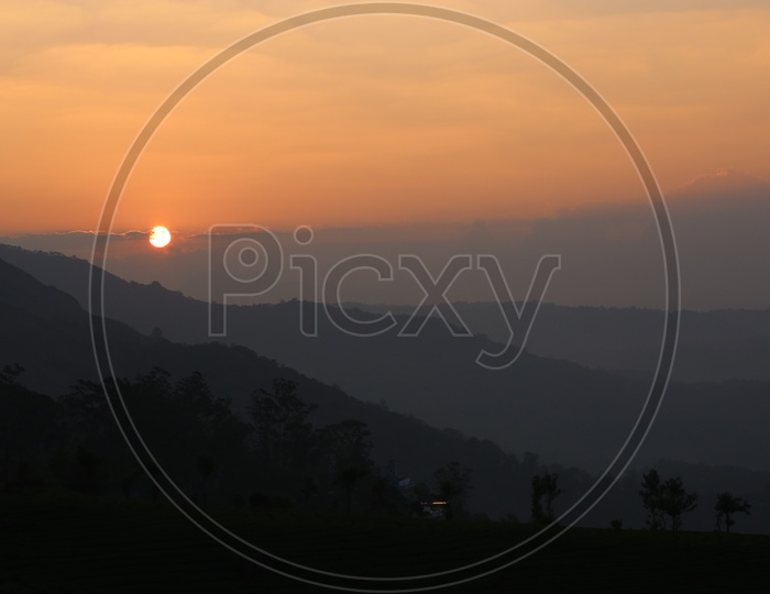 A Beautiful Sunset Over The Tea Plantations In Munnar