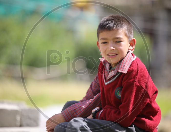 school kid from leh posing towards the camera
