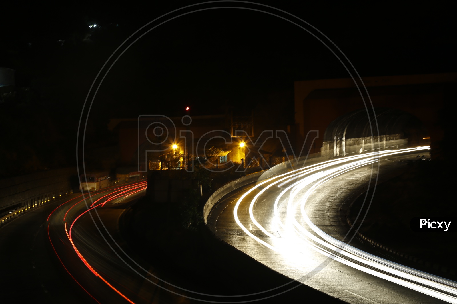 A long Exposure Shot Of a Bend In Roads Of Lonavala at  Night Time