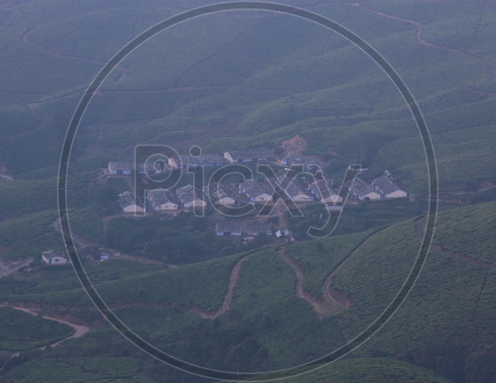 A Beautiful Aerial Shot Of Tea Factories in Munnar Valleys