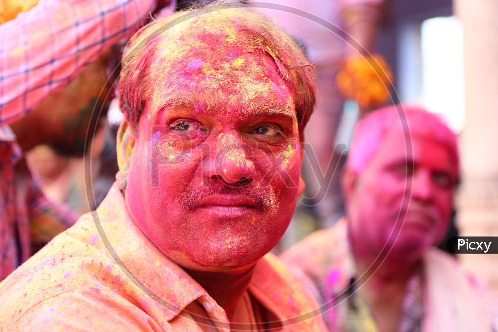 Man with colors on his face - Holi Celebrations - Indian Festival - Colors/Colorful at Nandagaon