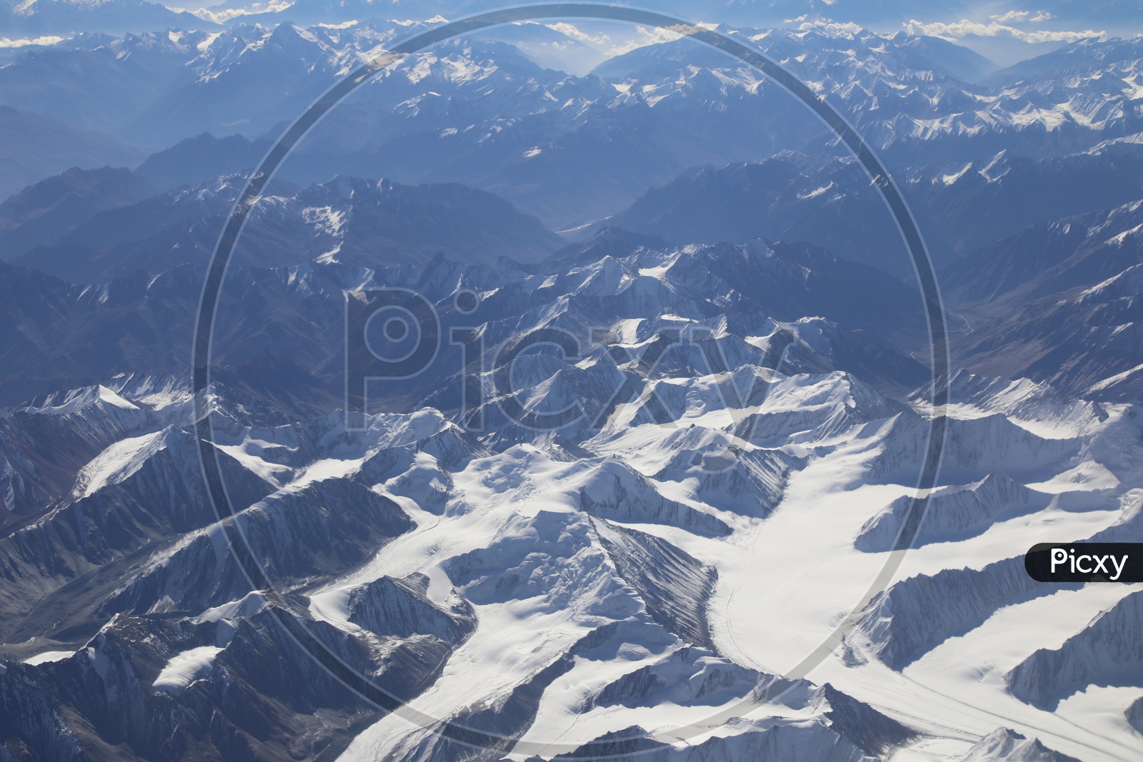 Beautiful Landscape of Snow Capped Mountains of Leh  from flight window / Leh mountains in Aerial View