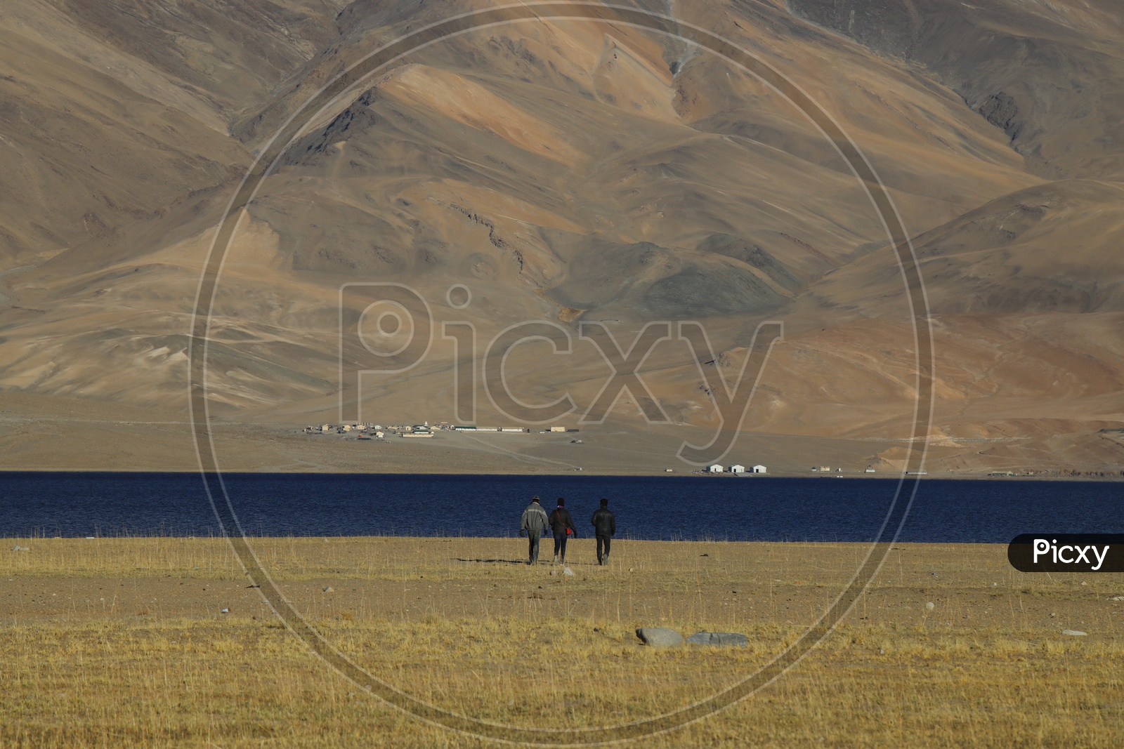 Tourists in The River Valleys Of Leh with Sand Dunes In Background
