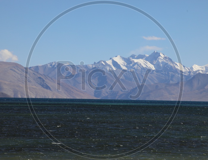 Beautiful Landscape of Snow Capped Mountains of Leh with Lake in the foreground