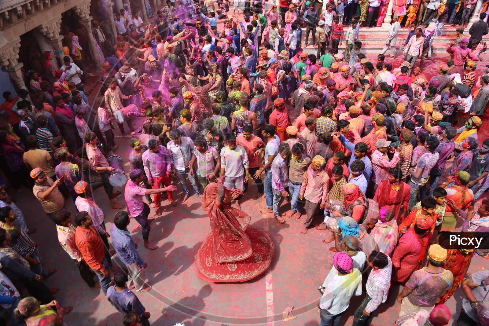 Woman Dancing at Holi Celebrations - Indian Festival - Colors/Colorful at Nandagaon Mandir