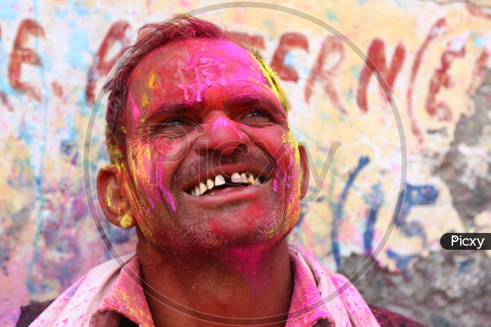 Man with Colors on face - Holi Celebrations - Indian Festival - Colors/Colorful at Nandagaon