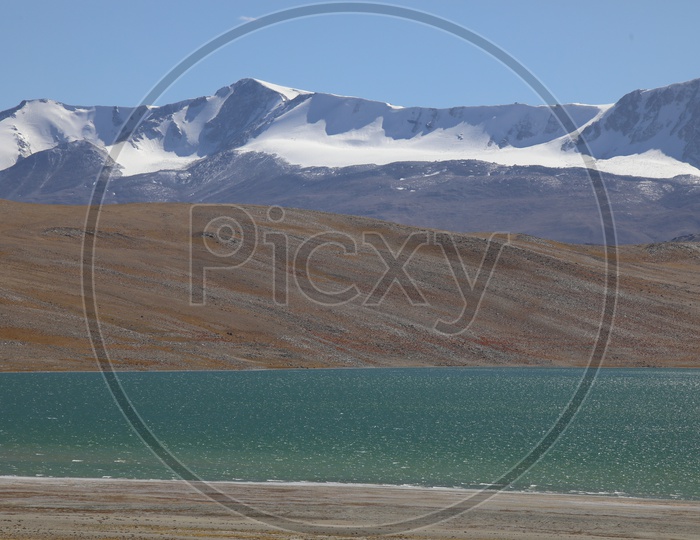 Beautiful Snow capped Mountains of leh with lake in the foreground