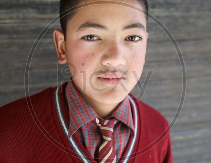Portrait of a school Kid from leh posing towards the camera