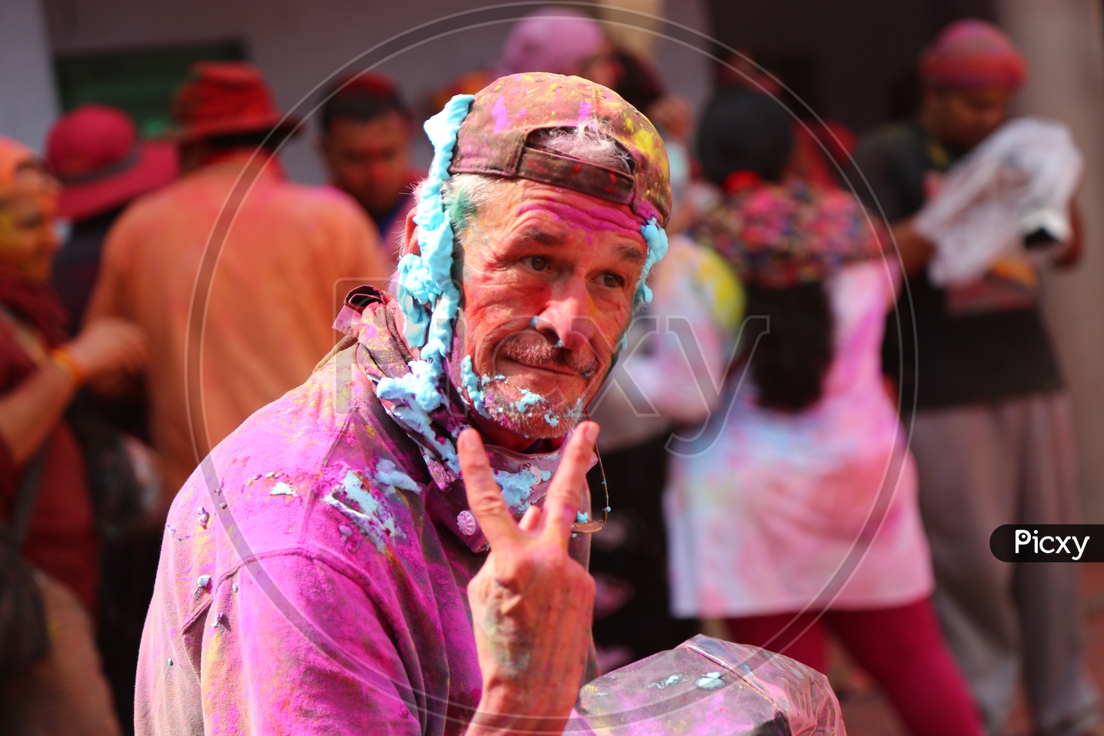 Old Man with colors on his face - Holi Celebrations - Indian Festival - Colors/Colorful at Nandagaon