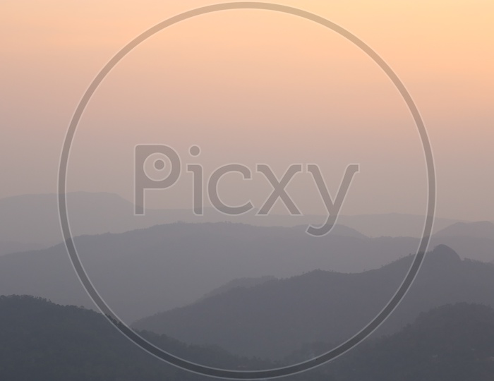 Mountains of munnar with orange sky